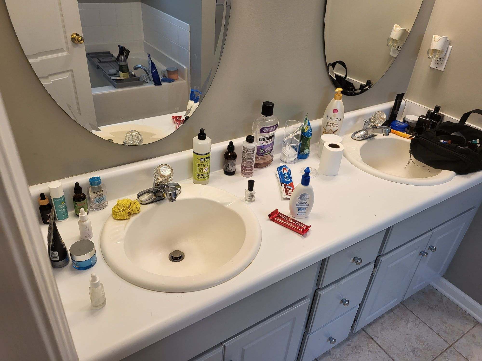 Bathroom vanity with outdated round sinks